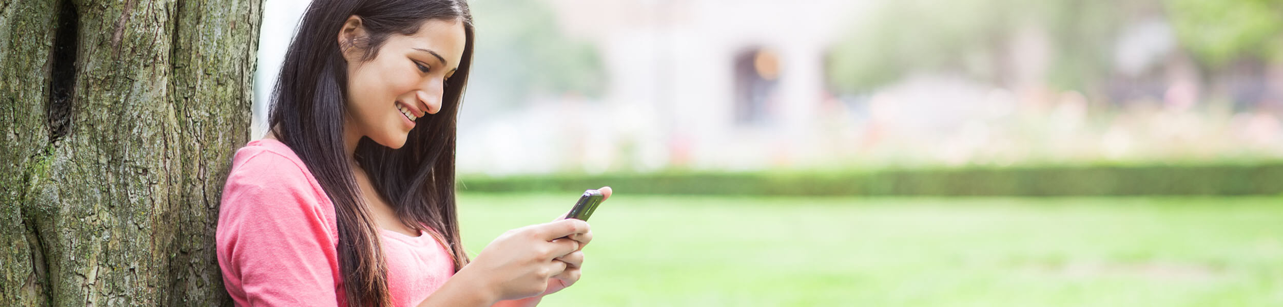 girl looking at app outside