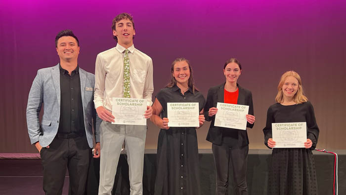 pine view high school students holding scholarship certificates