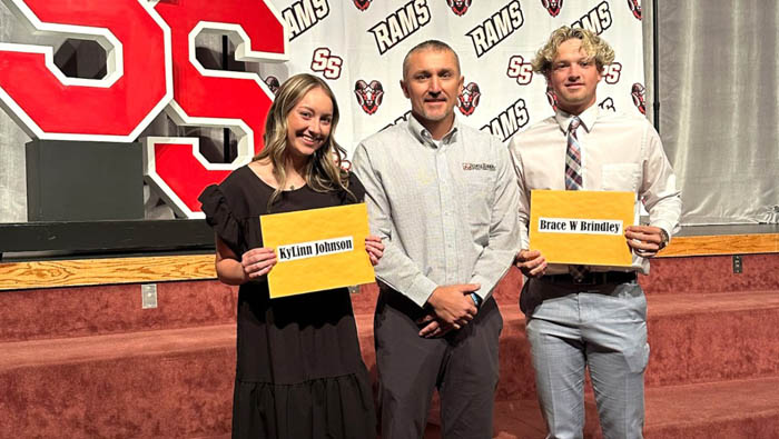 rams high school students holding scholarship certificates