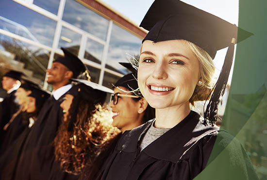 girl graduating high school wearing a cap and gown
