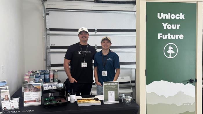 parade of homes state bank employees working at a booth