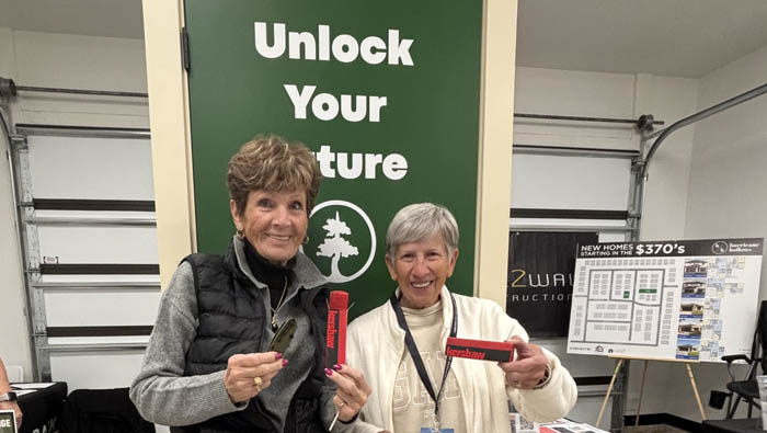 parade of homes winners holding prizes of kershaw knives