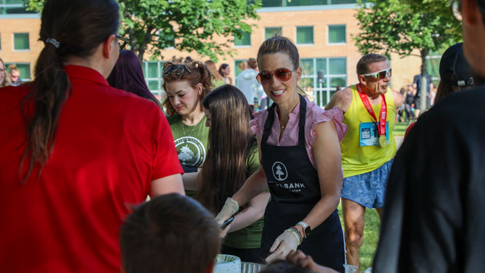 people serving pancakes